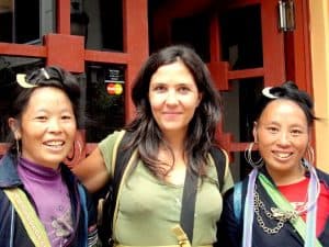 A female traveler with two Hmong women