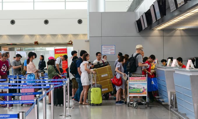 Busy check-in counter at a Vietnam airport