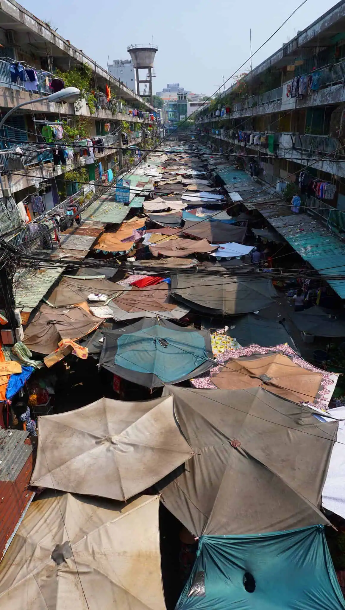 Umbrellas at old apartments in Saigon